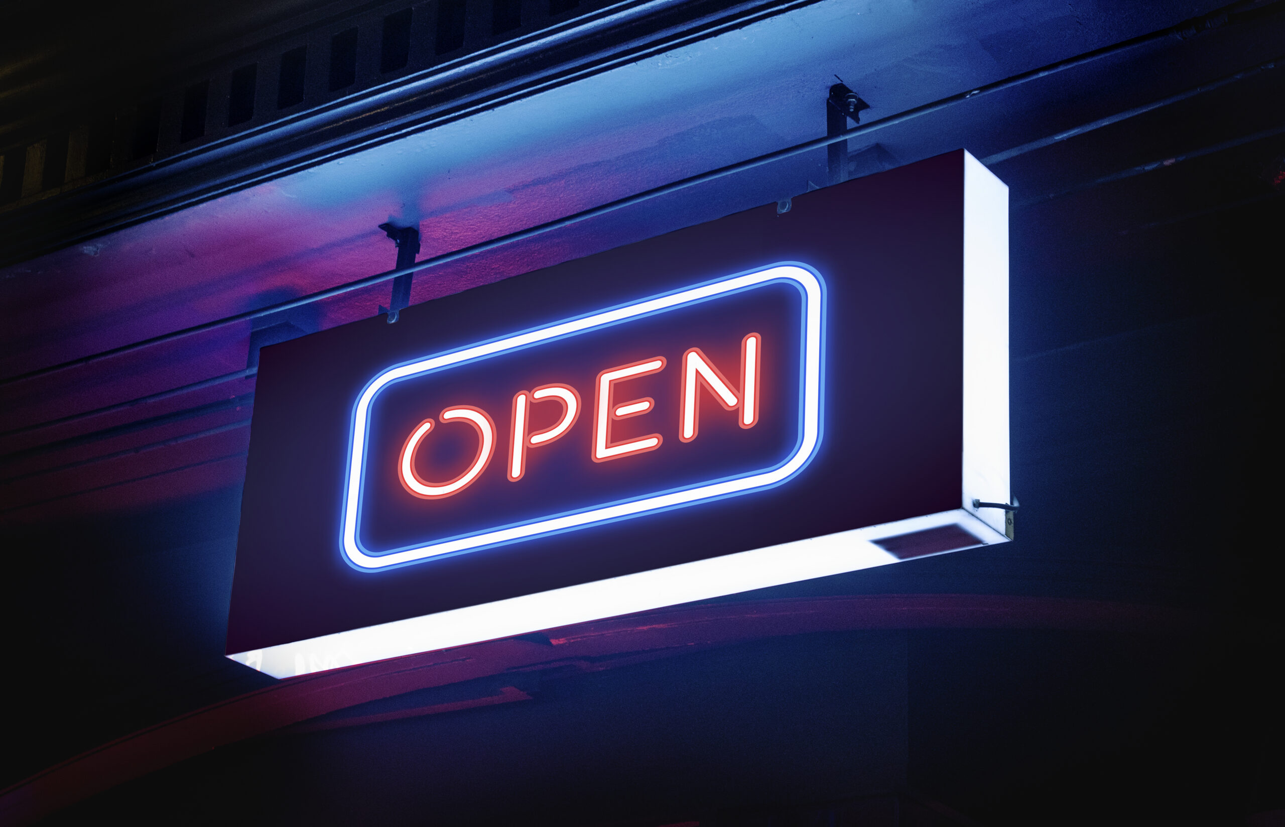 Open word signage in neon lights